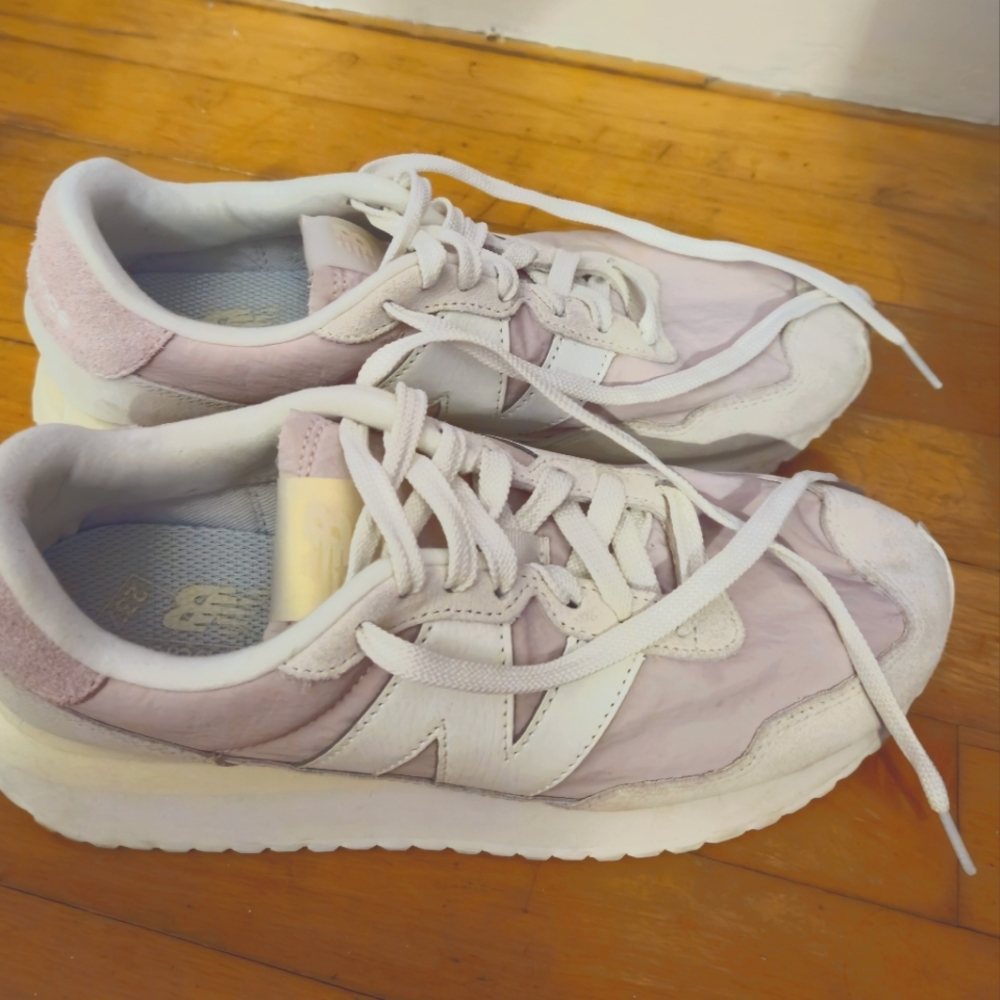 Purple and white New Balance sneakers